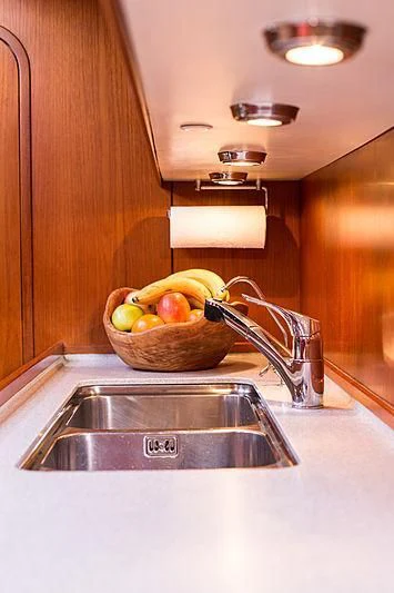a bowl of fruit on a kitchen counter aboard PAN Yacht for Sale