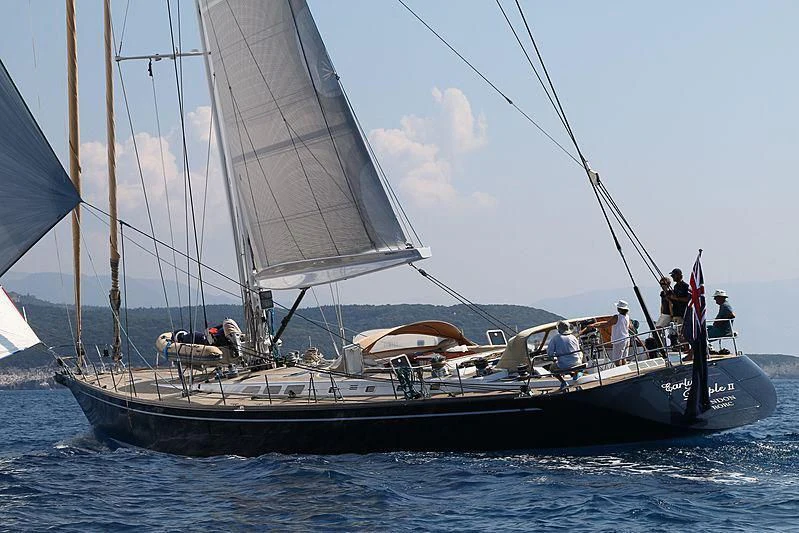 a sailboat with people on it aboard PAN Yacht for Sale