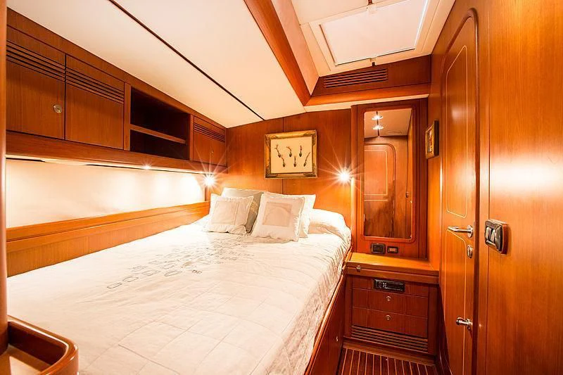 a bed in a room aboard PAN Yacht for Sale