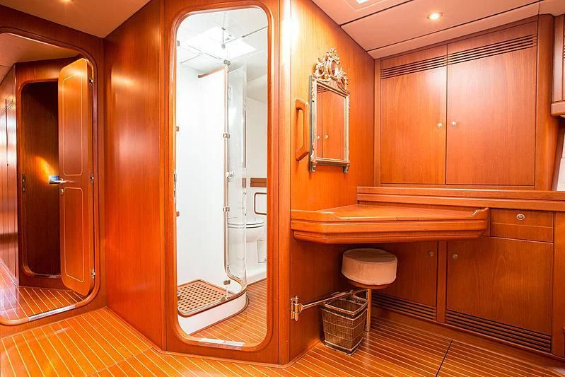 a bathroom with a glass shower aboard PAN Yacht for Sale