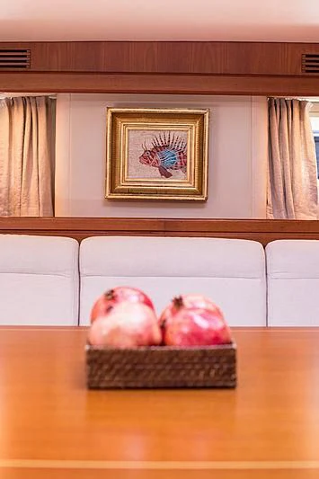 a bowl of apples aboard PAN Yacht for Sale