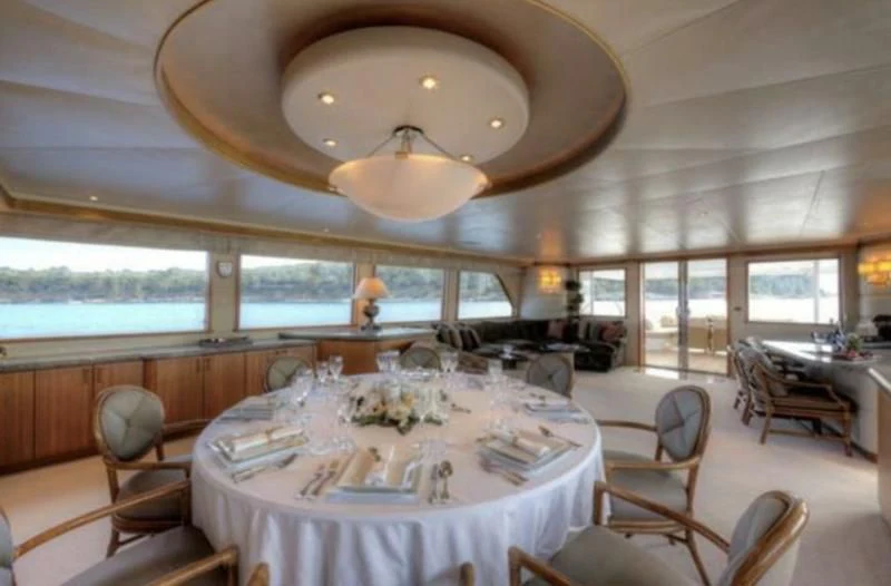 a dining room with a large table aboard INTEGRITY Yacht for Sale