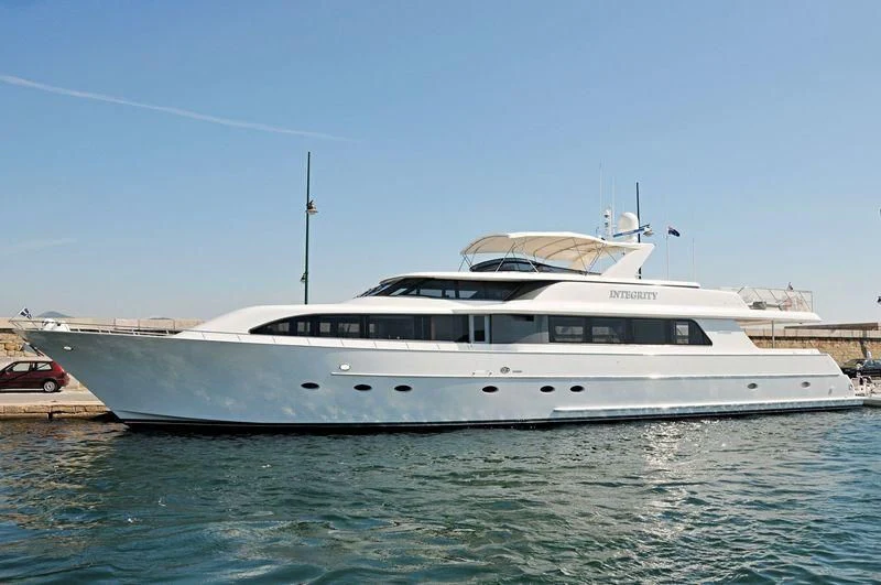 a white yacht in the water aboard INTEGRITY Yacht for Sale