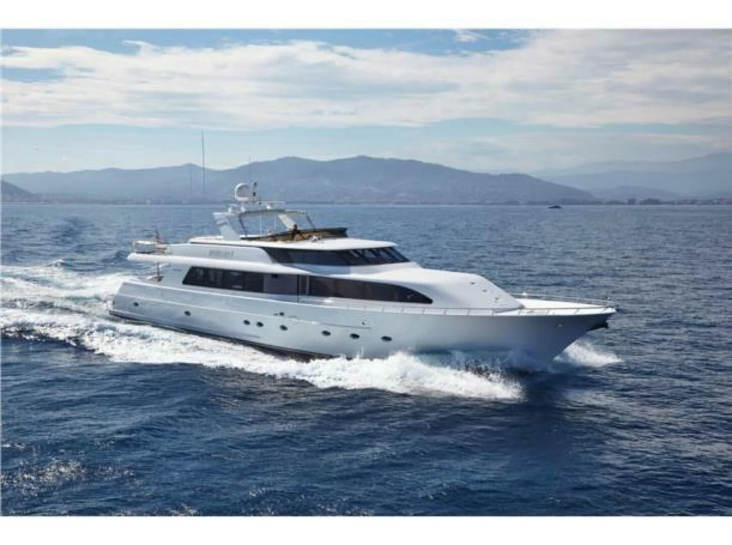 a white yacht in the water aboard INTEGRITY Yacht for Sale