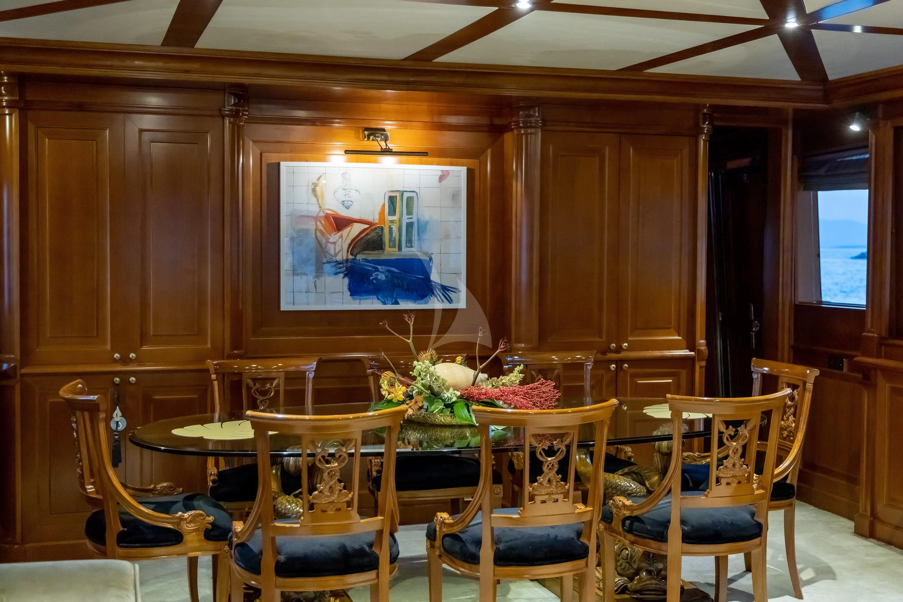 a room with tables and chairs aboard AQUILA Yacht for Sale