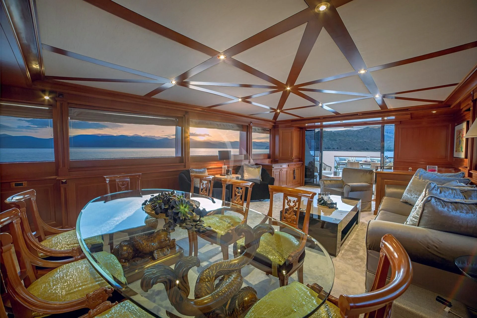 a large room with a table and chairs aboard AQUILA Yacht for Sale
