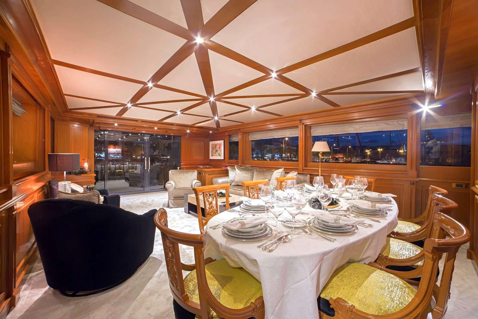 a dining room with a table set aboard AQUILA Yacht for Sale