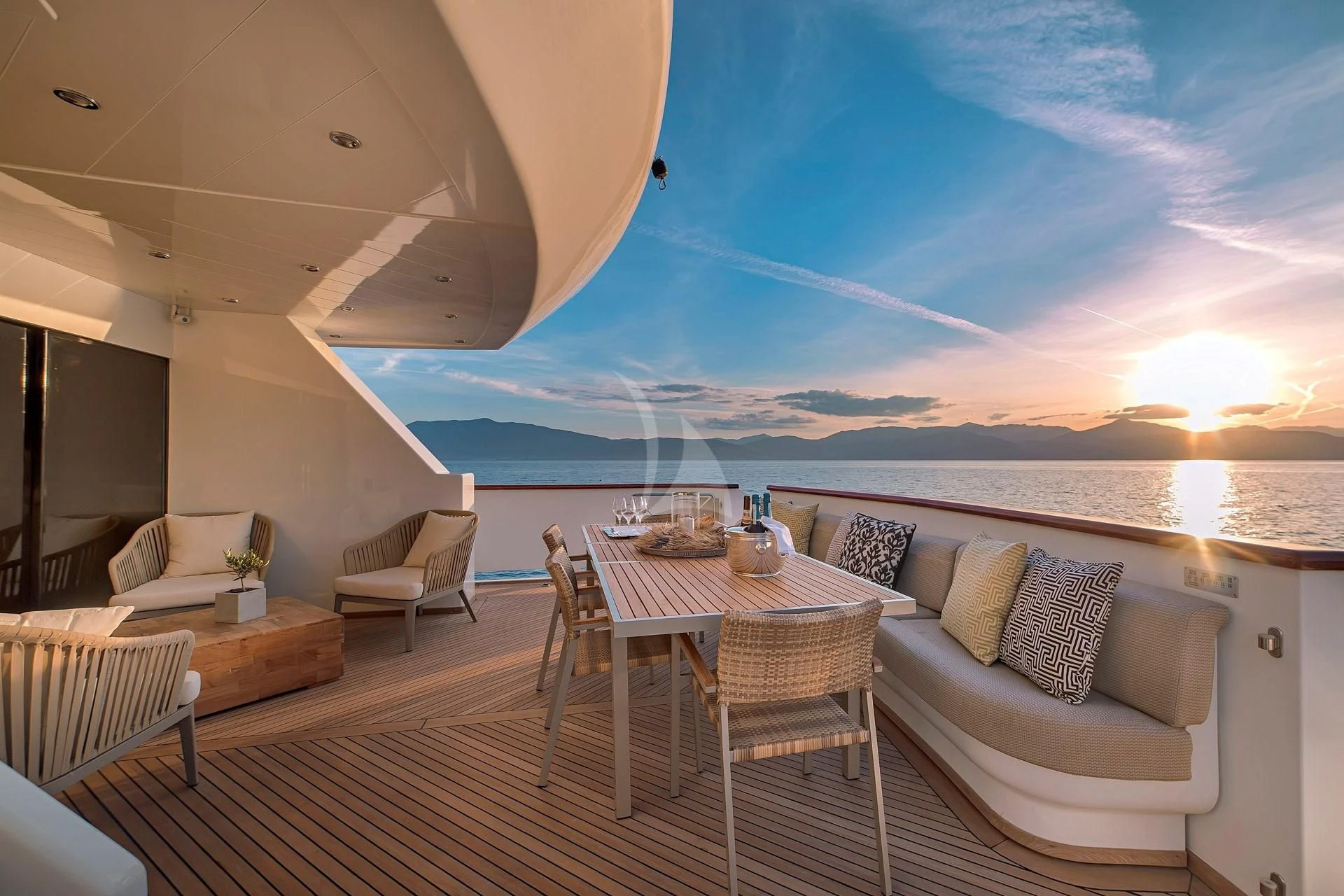 a large living room with a large balcony overlooking the ocean aboard AQUILA Yacht for Sale