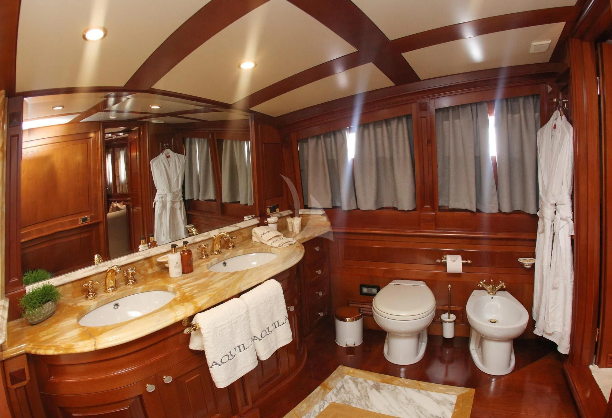 a bathroom with a large mirror aboard AQUILA Yacht for Sale