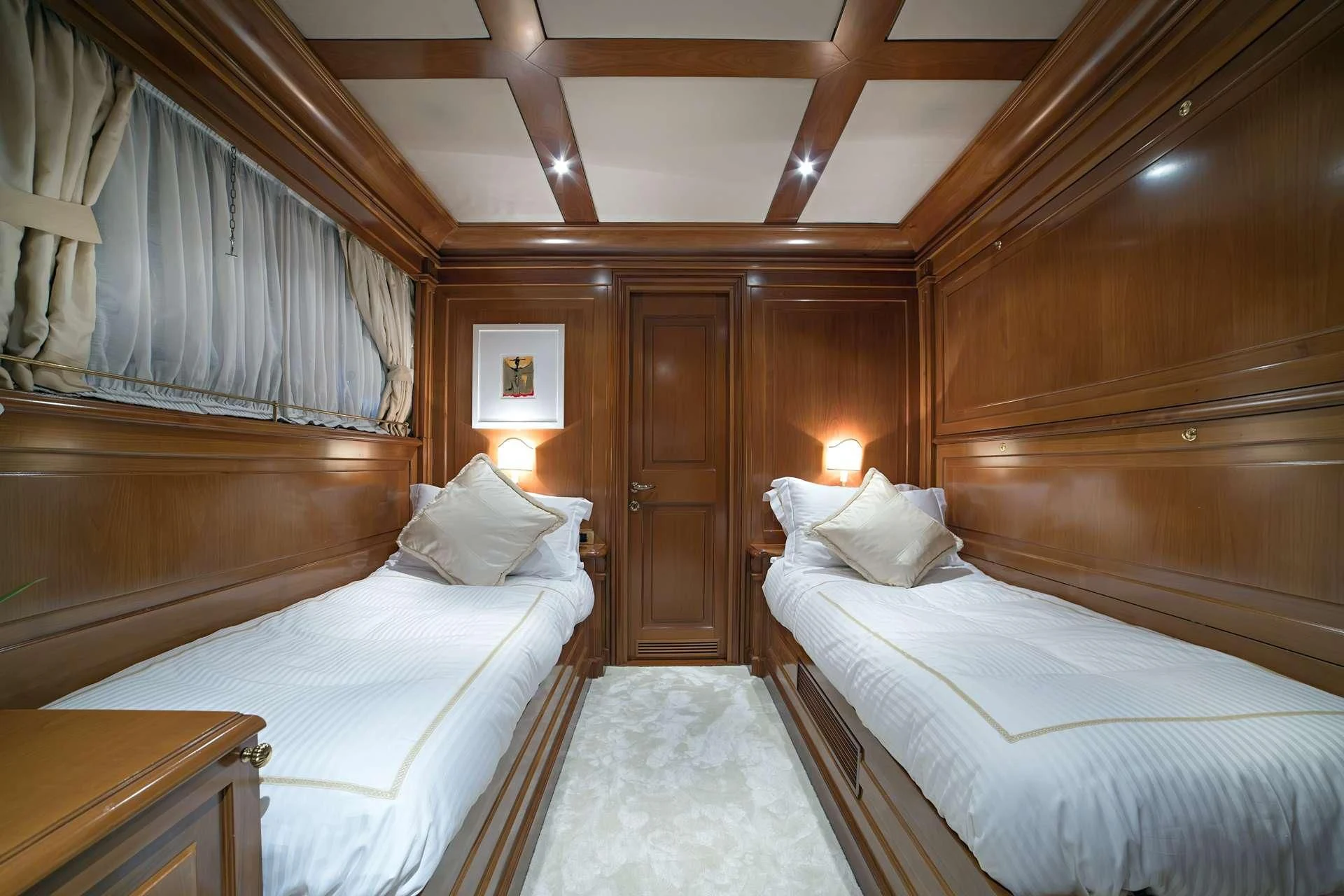 a room with two beds aboard AQUILA Yacht for Sale
