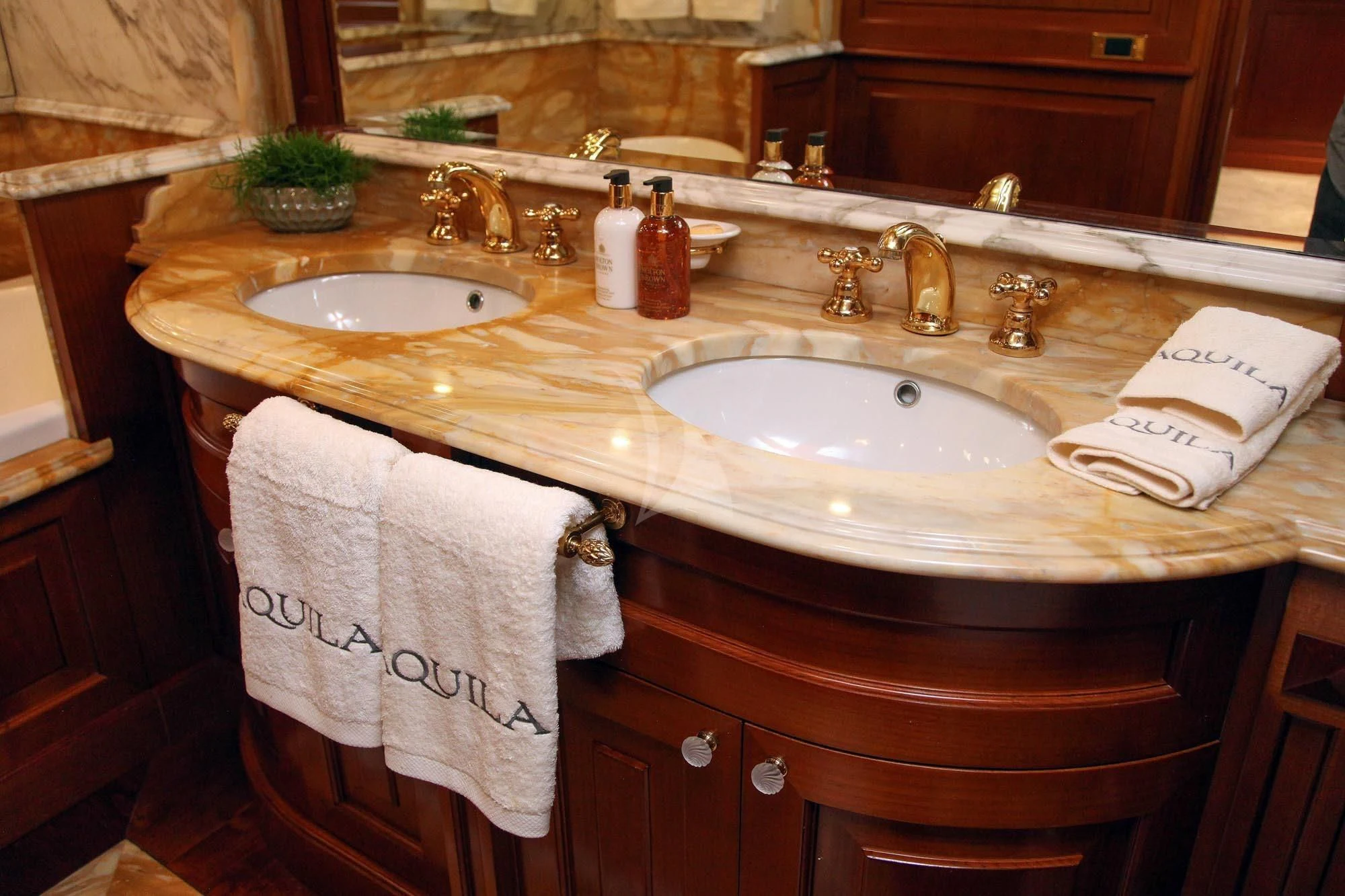 a bathroom with a towel and a sink aboard AQUILA Yacht for Sale