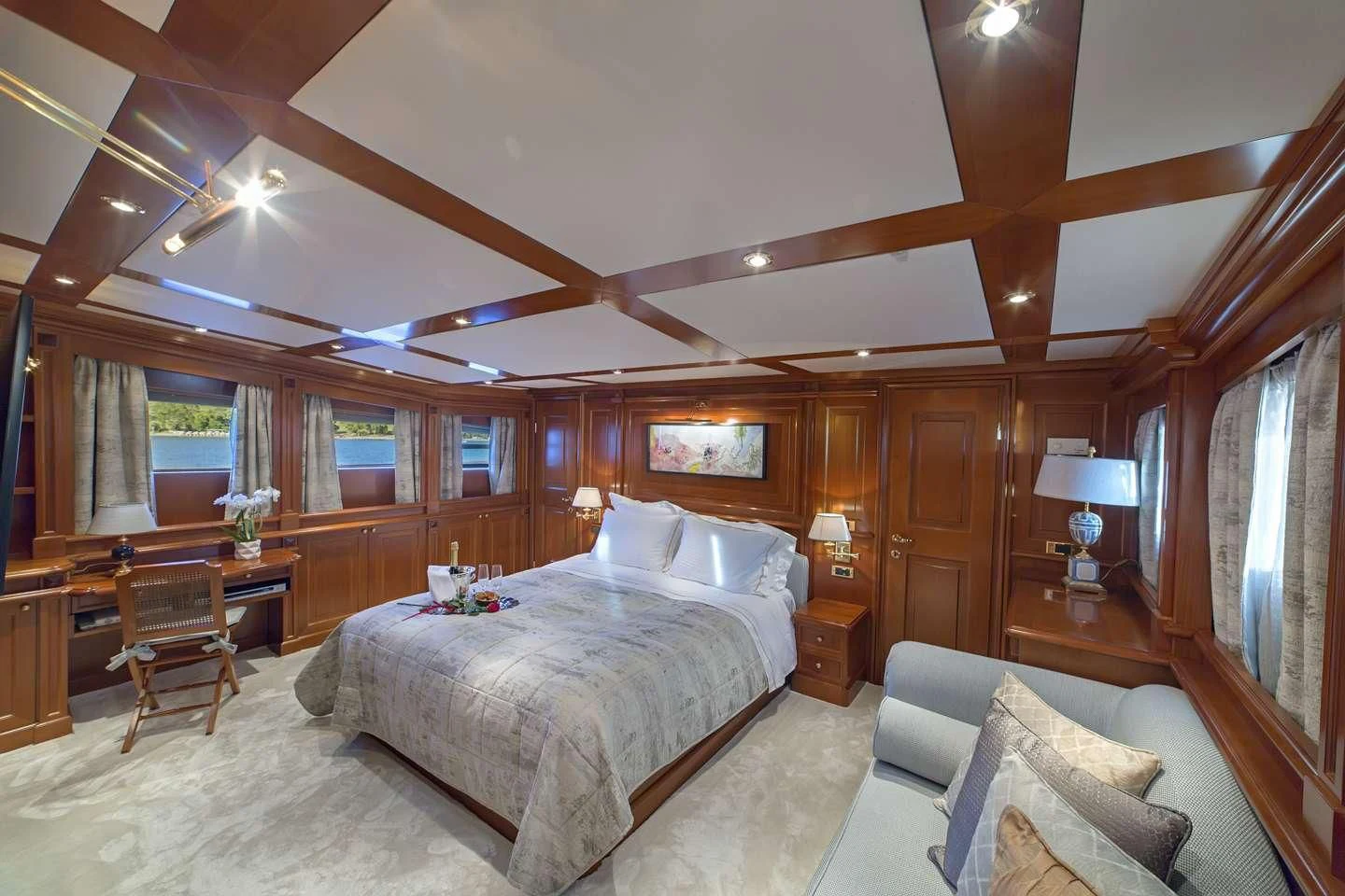 a large bedroom with a large bed aboard AQUILA Yacht for Sale