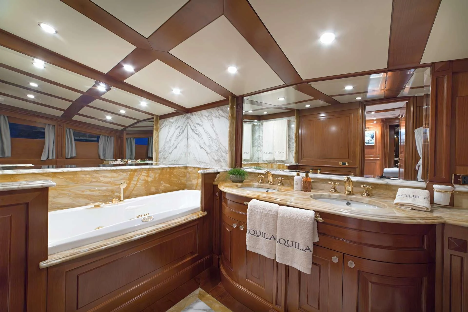 a bathroom with a large mirror aboard AQUILA Yacht for Sale