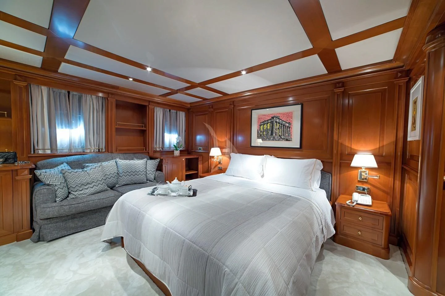 a bedroom with a bed and a couch aboard AQUILA Yacht for Sale
