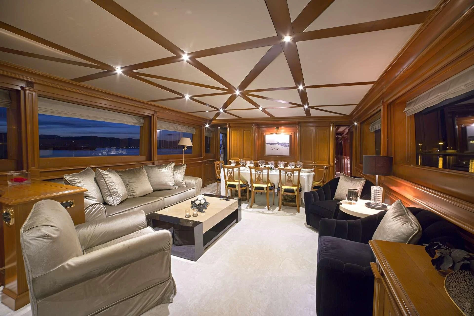 a living room with a large screen aboard AQUILA Yacht for Sale