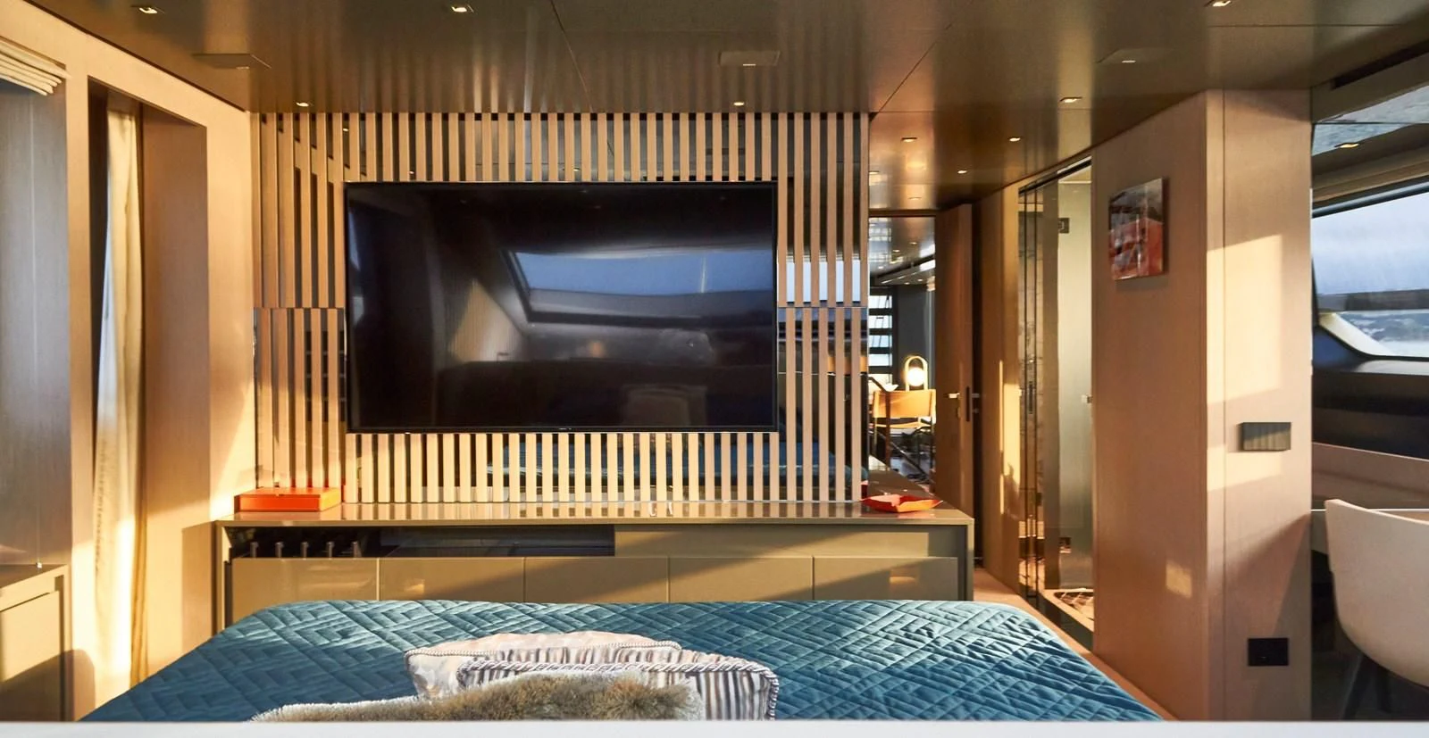 a room with a tv and a bed aboard SL96A Yacht for Sale
