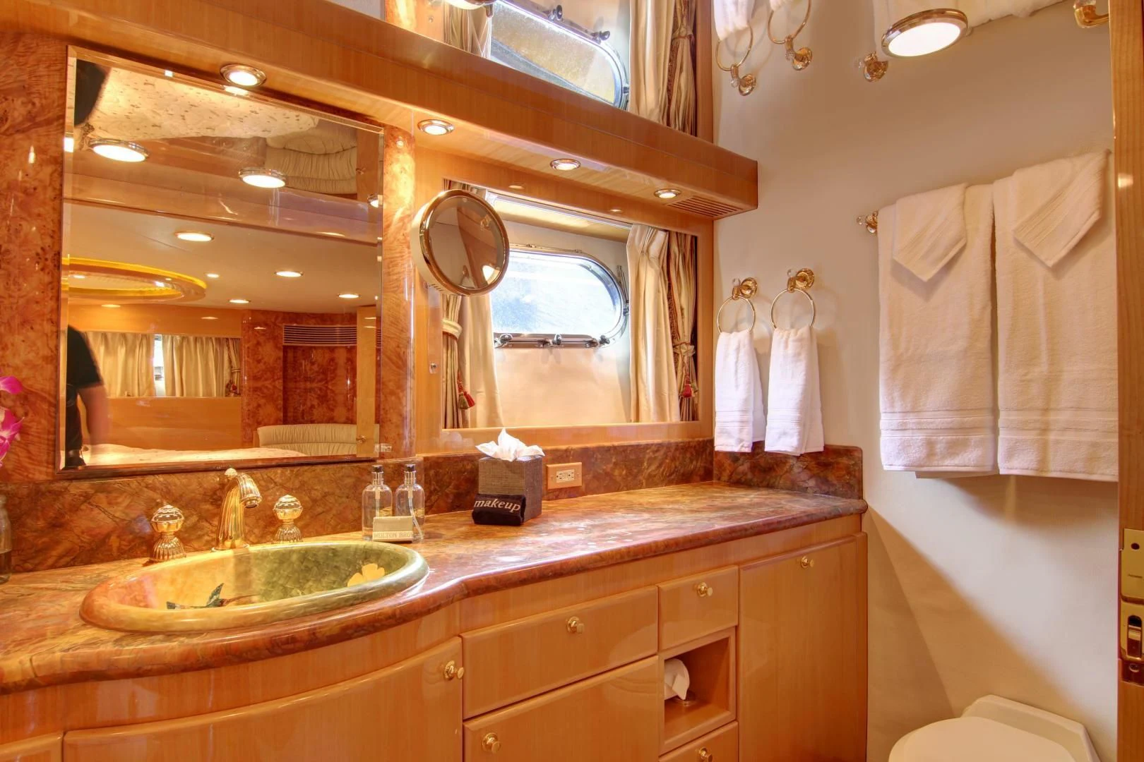a bathroom with a large mirror aboard UNSINKABLE II Yacht for Sale