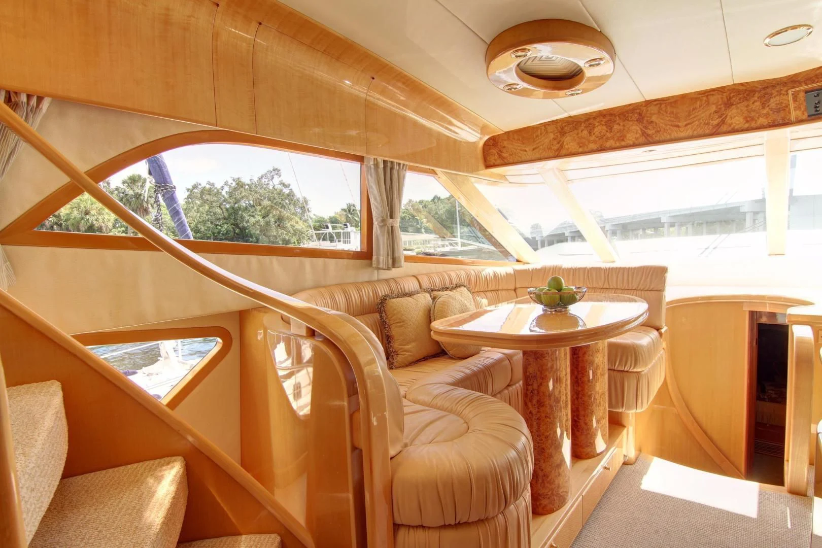 a room with a table and chairs aboard UNSINKABLE II Yacht for Sale