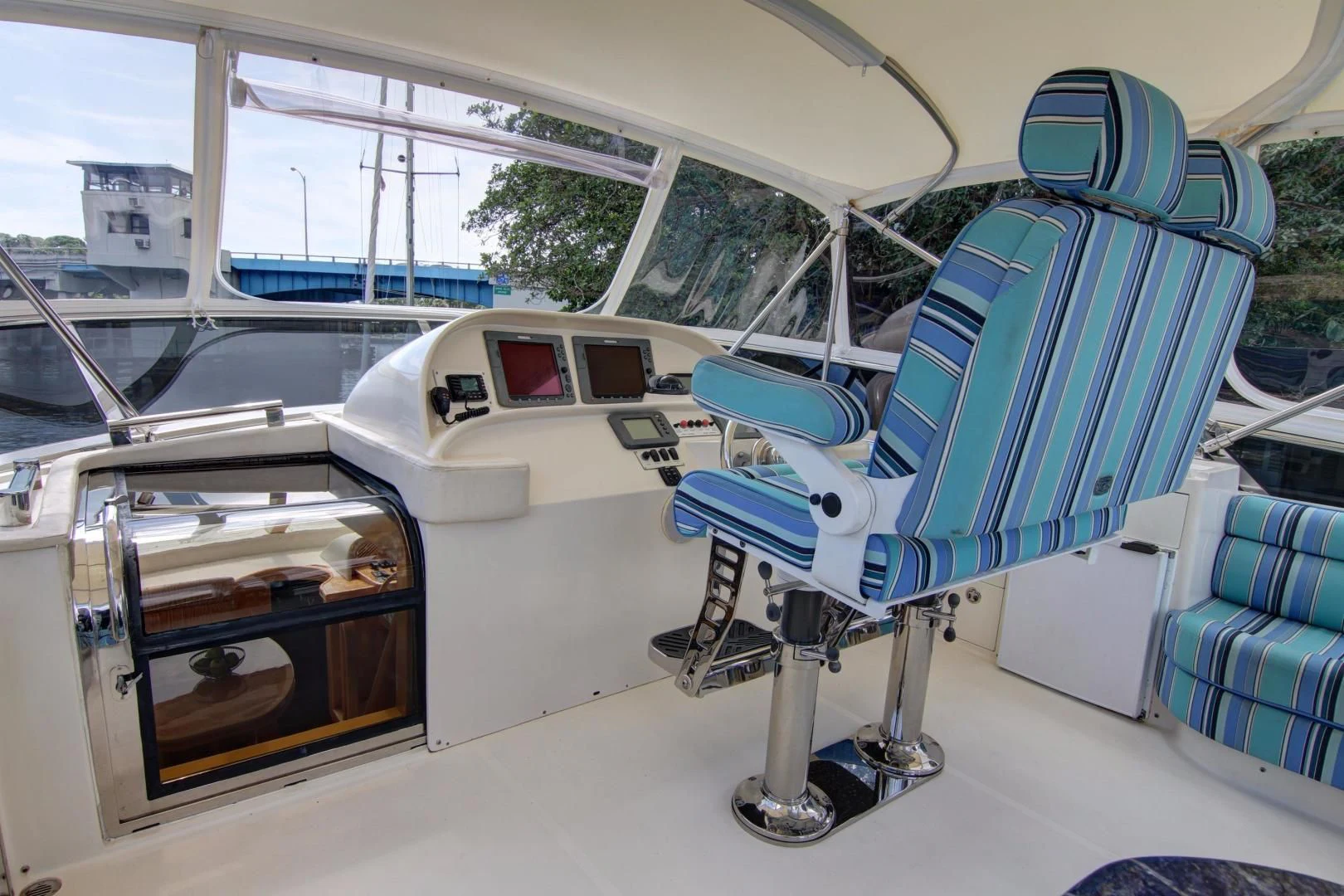 a white car with a blue seat aboard UNSINKABLE II Yacht for Sale