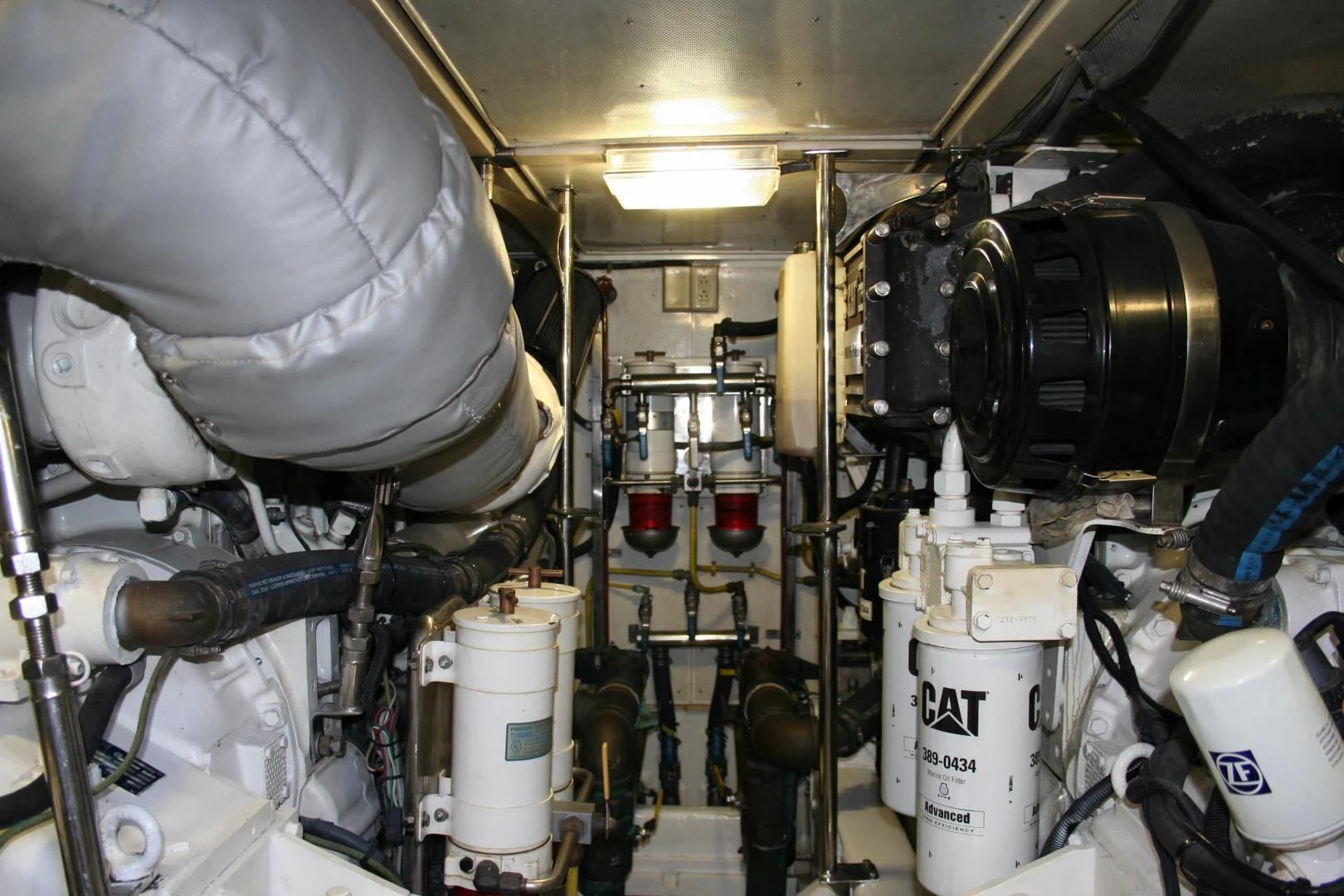 a large machine with many pipes aboard UNSINKABLE II Yacht for Sale
