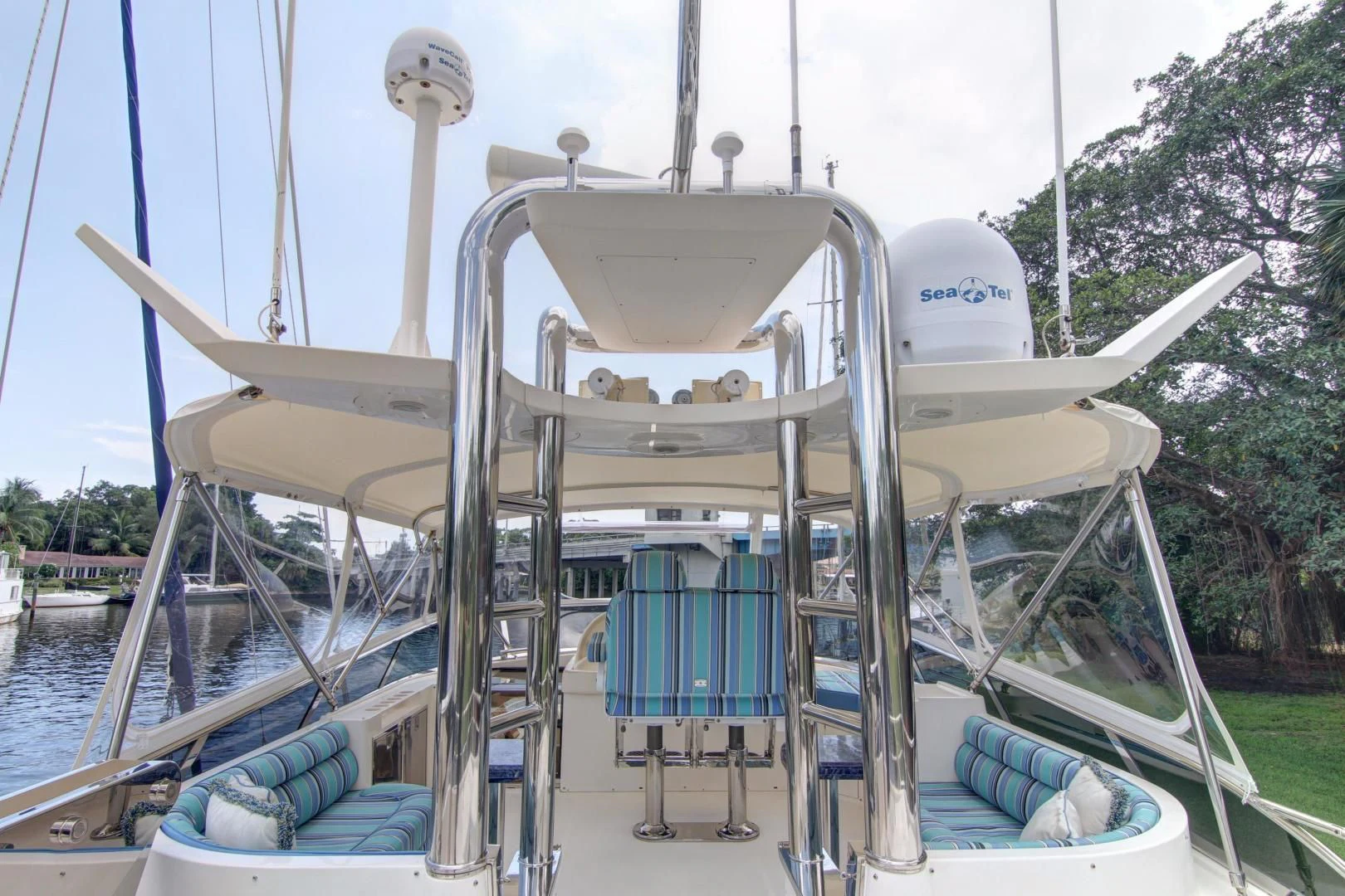 a white boat with a metal frame aboard UNSINKABLE II Yacht for Sale