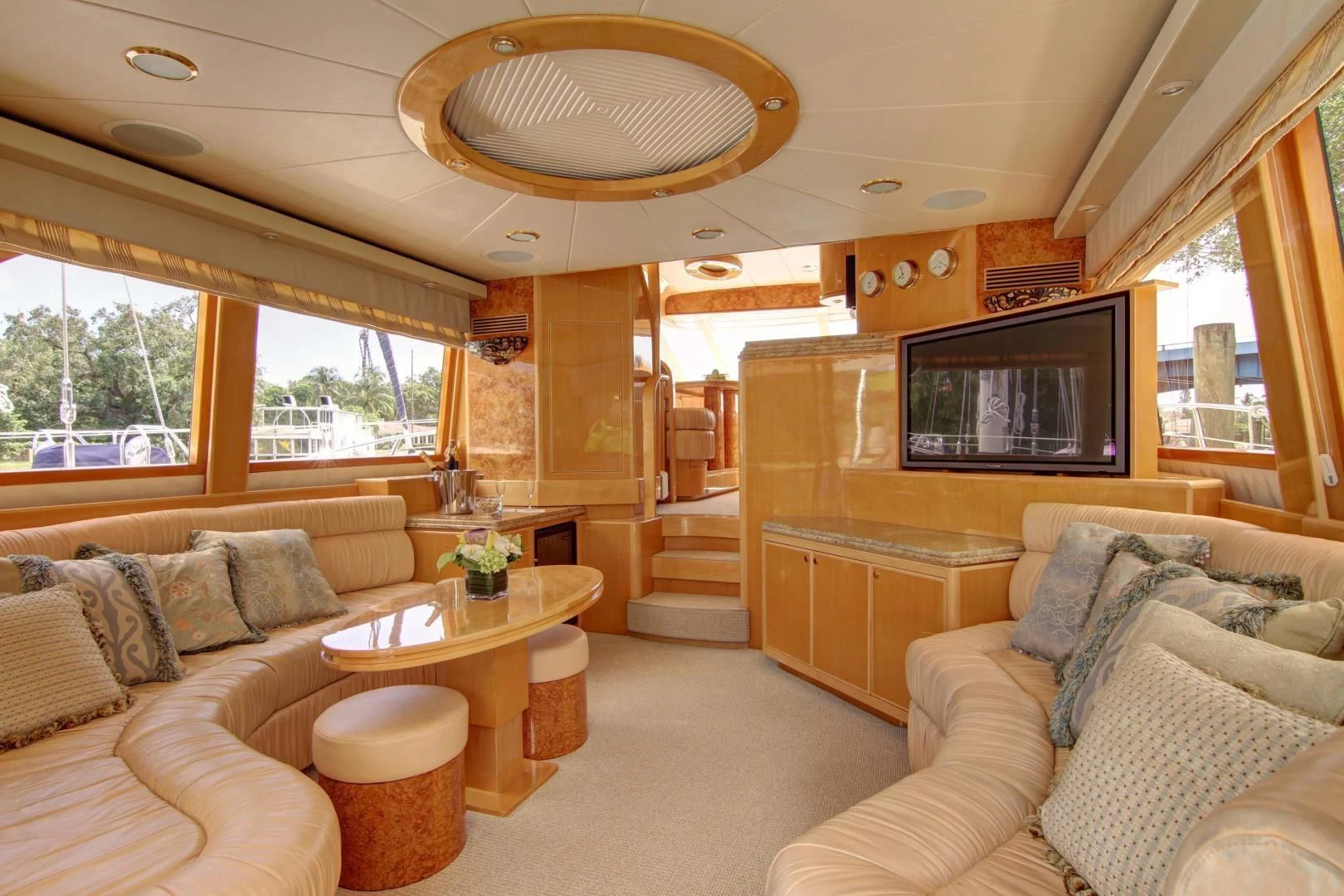 a living room with a couch and a tv aboard UNSINKABLE II Yacht for Sale