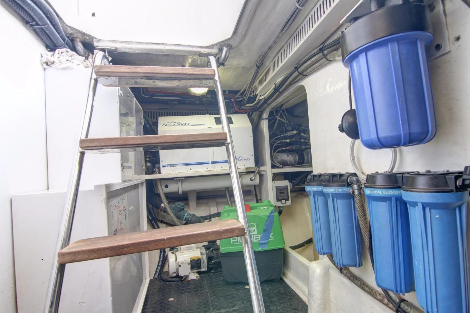 a large white machine with a ladder aboard UNSINKABLE II Yacht for Sale