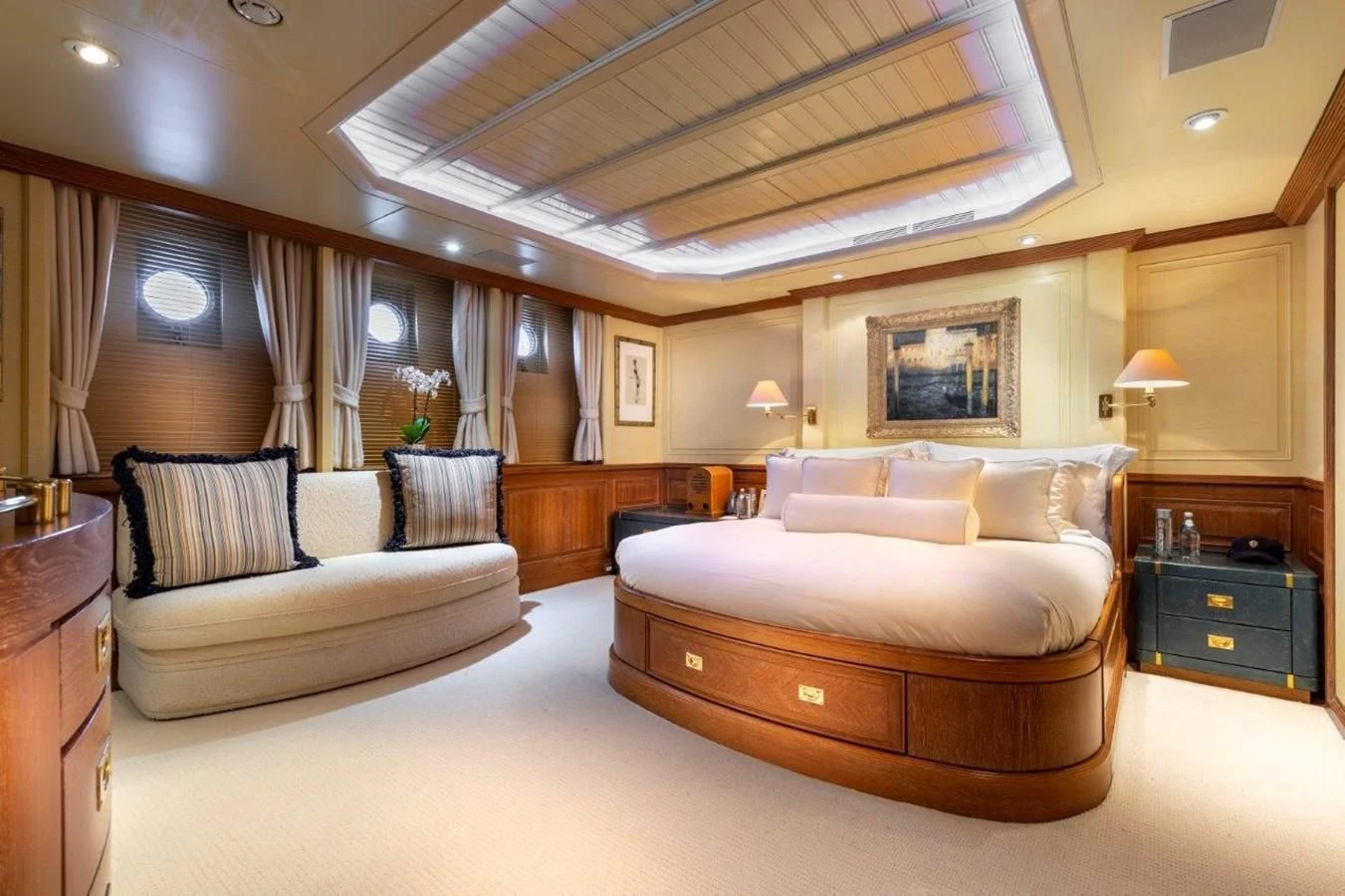 a large bedroom with a bed and a couch aboard GLACIAL BEAR Yacht for Sale