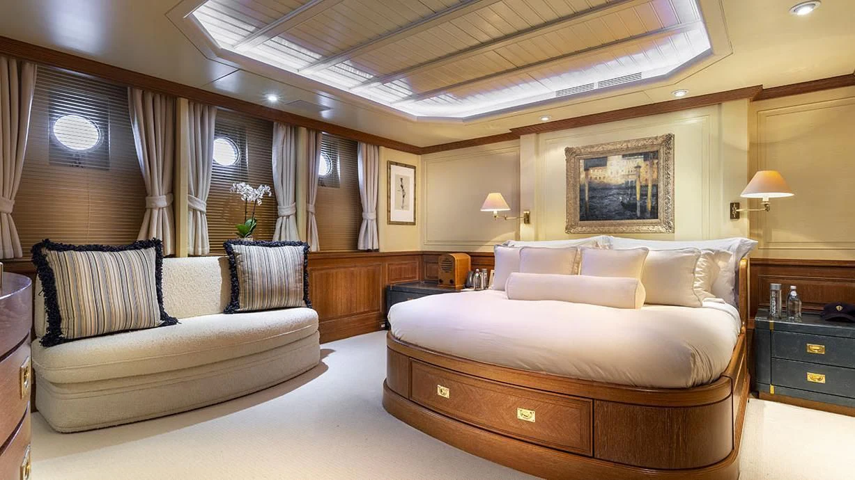a room with a bed and a couch aboard GLACIAL BEAR Yacht for Sale