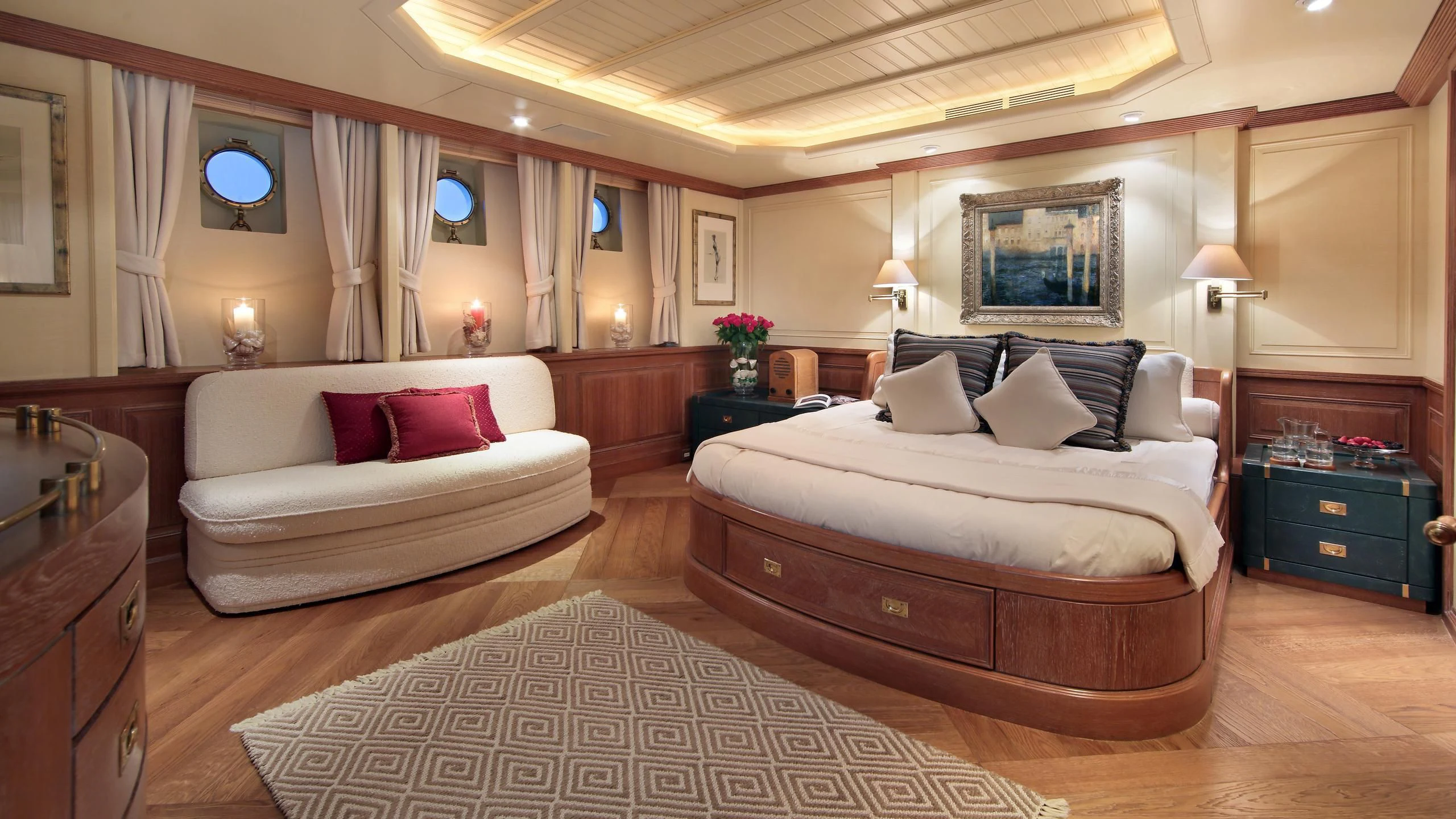 a large bedroom with a bed and a couch aboard GLACIAL BEAR Yacht for Sale