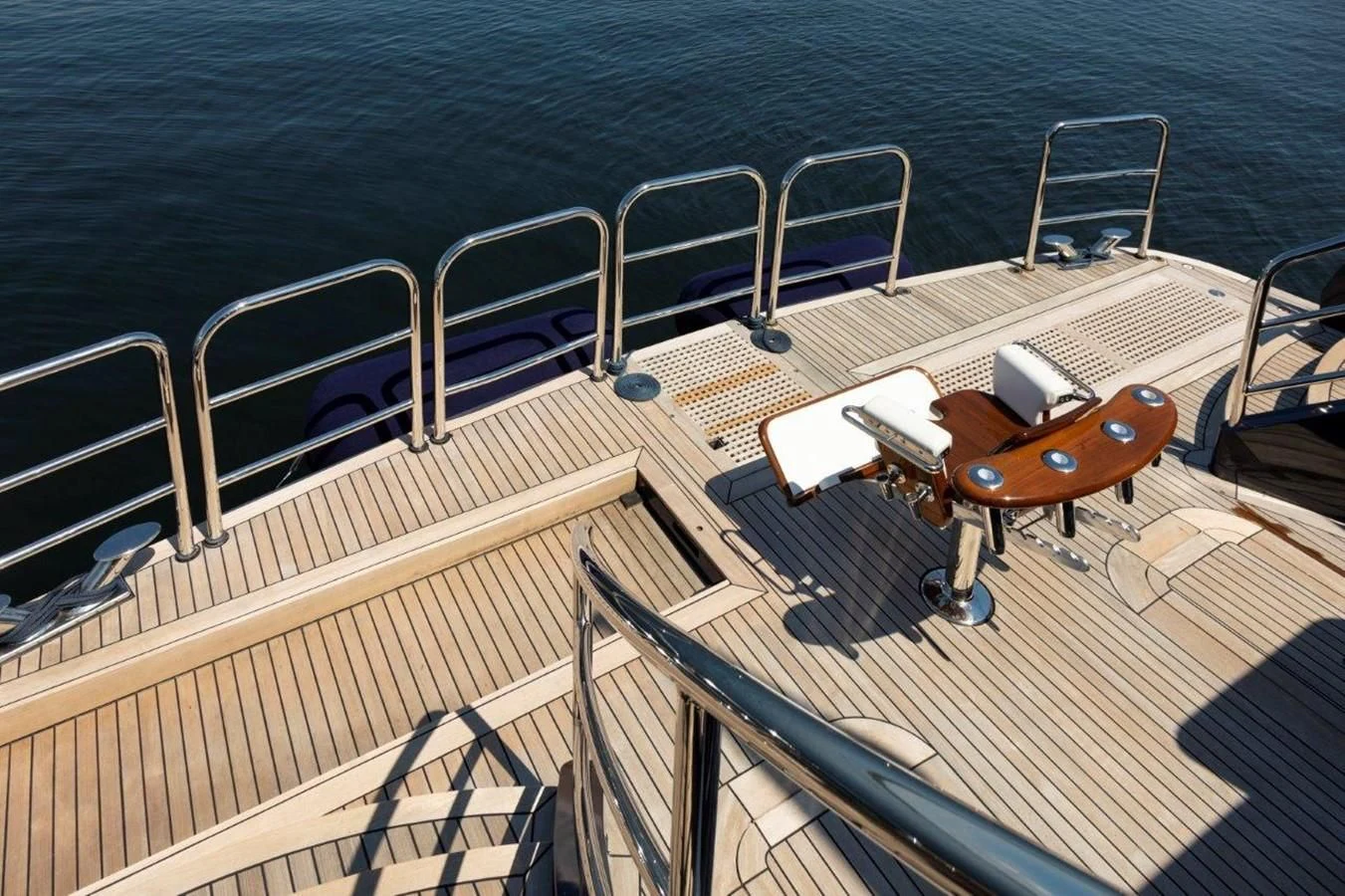 a boat deck with chairs and a suitcase on it aboard GLACIAL BEAR Yacht for Sale