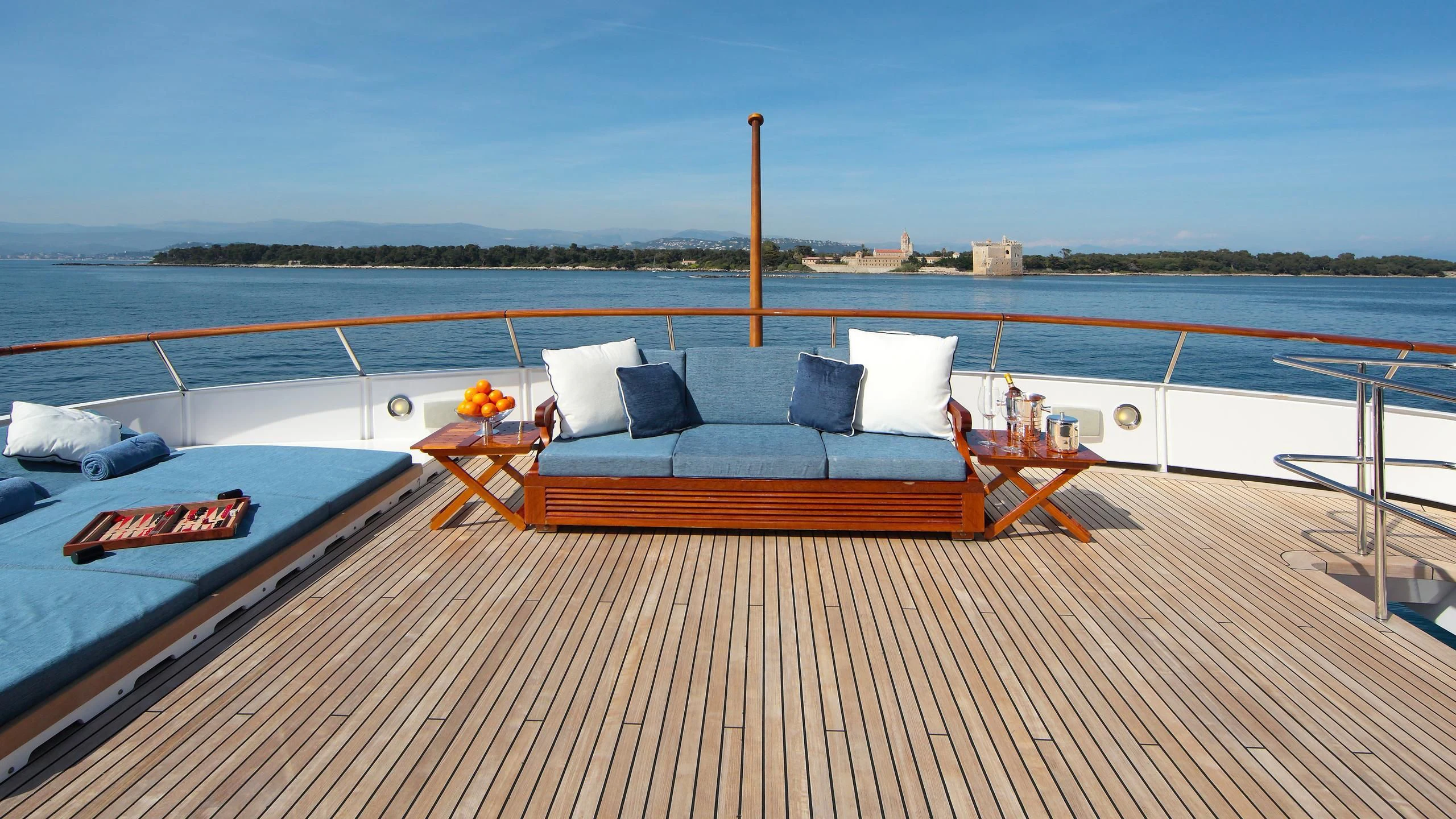 a deck with a couch and pillows on it aboard GLACIAL BEAR Yacht for Sale