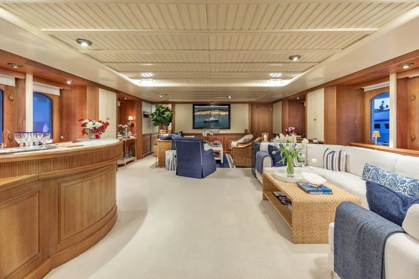 a large room with a table and chairs aboard GLACIAL BEAR Yacht for Sale