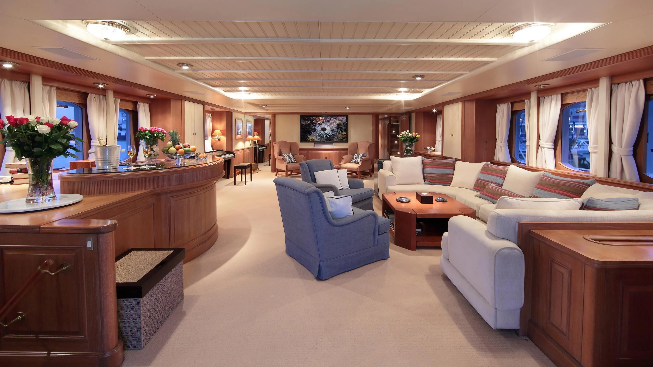 a large living room with a large window aboard GLACIAL BEAR Yacht for Sale