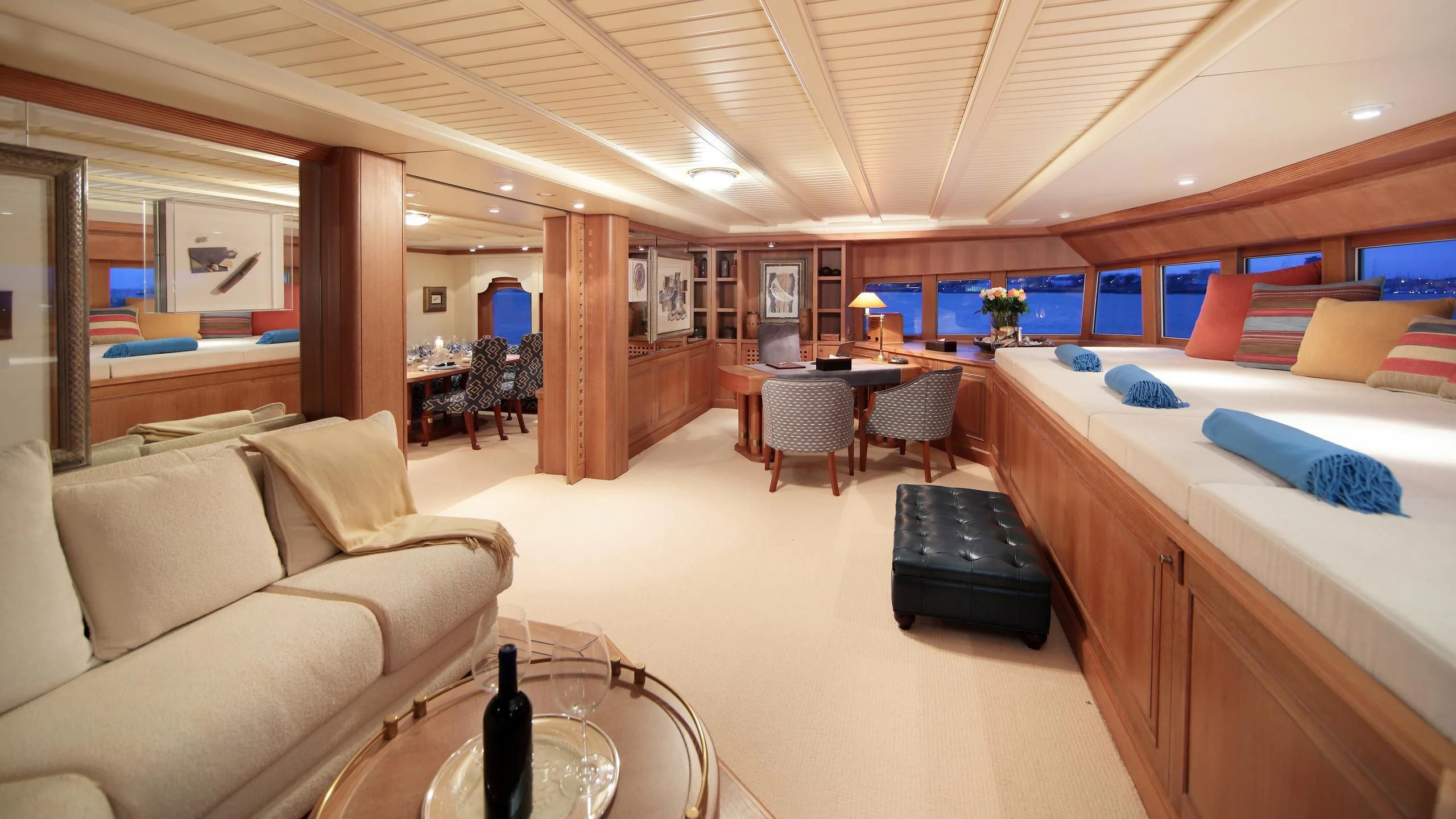 a room with a couch and a table and chairs aboard GLACIAL BEAR Yacht for Sale