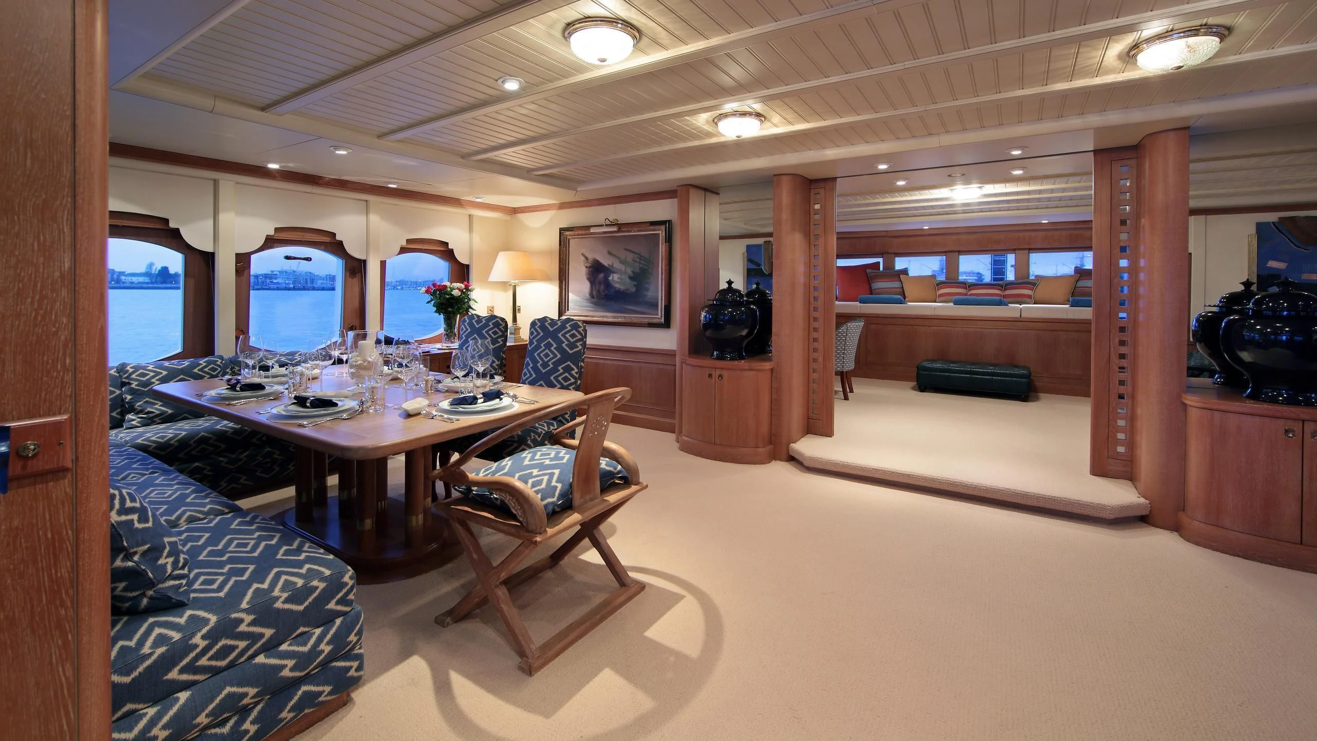 a room with a table and chairs aboard GLACIAL BEAR Yacht for Sale