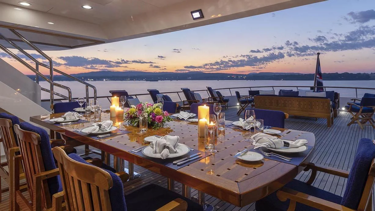 a table set for a dinner on a ship aboard GLACIAL BEAR Yacht for Sale