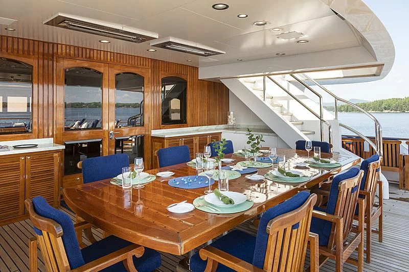 a dining room with a table set for a party aboard GLACIAL BEAR Yacht for Sale