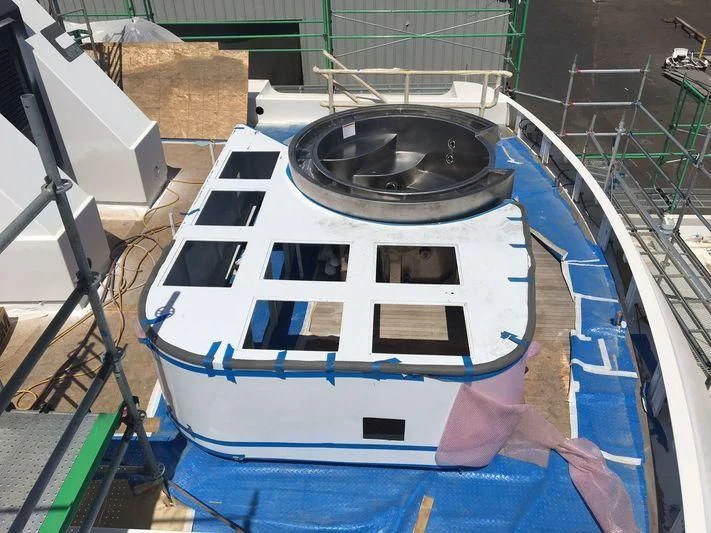 a person holding a large metal object aboard GLACIAL BEAR Yacht for Sale