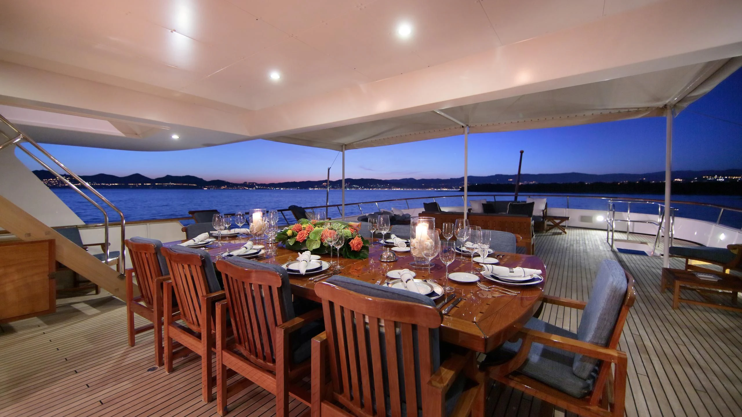 a dining table on a deck aboard GLACIAL BEAR Yacht for Sale
