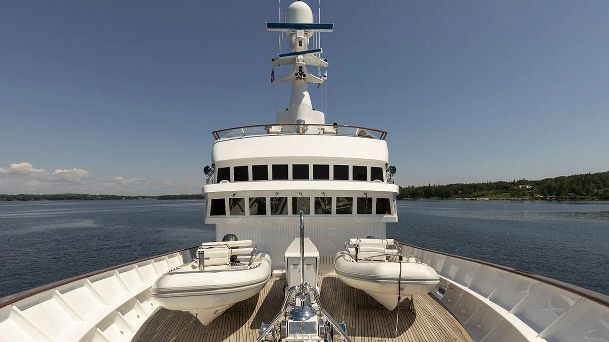 a white boat on a body of water aboard GLACIAL BEAR Yacht for Sale