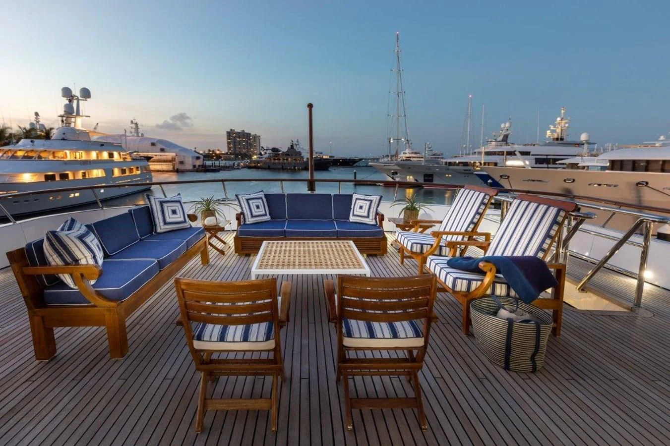a deck with chairs and tables on it aboard GLACIAL BEAR Yacht for Sale