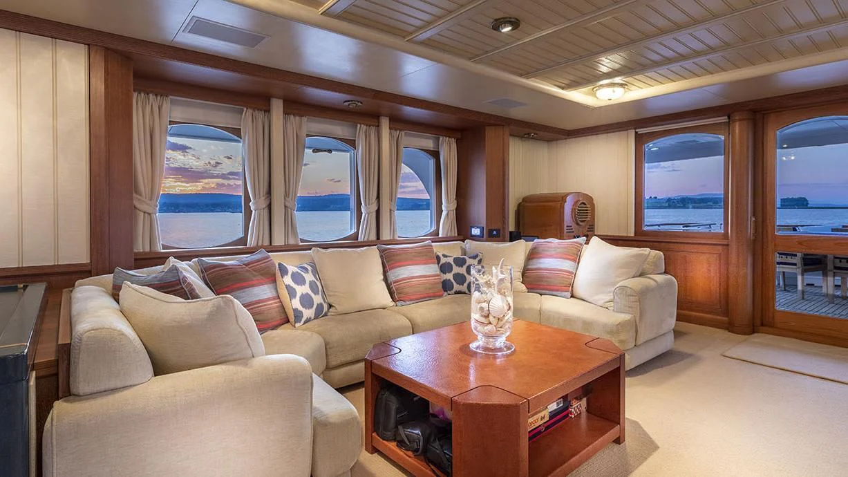 a living room with a couch and a coffee table aboard GLACIAL BEAR Yacht for Sale