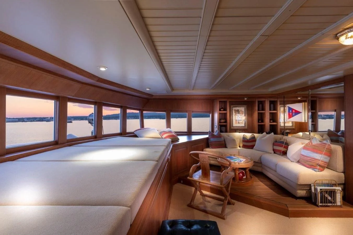a room with a couch and a table aboard GLACIAL BEAR Yacht for Sale
