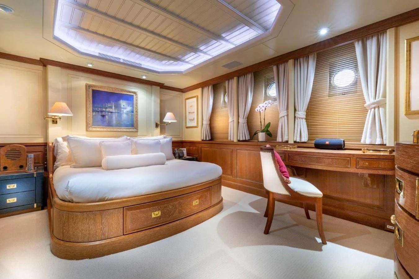 a room with a bed and a desk aboard GLACIAL BEAR Yacht for Sale