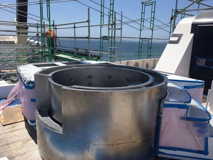 a metal bucket on a wooden deck aboard GLACIAL BEAR Yacht for Sale