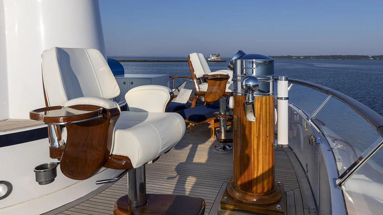 a boat with a wooden steering wheel aboard GLACIAL BEAR Yacht for Sale