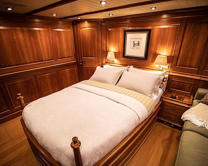 a bed in a room aboard ATHOS Yacht for Sale