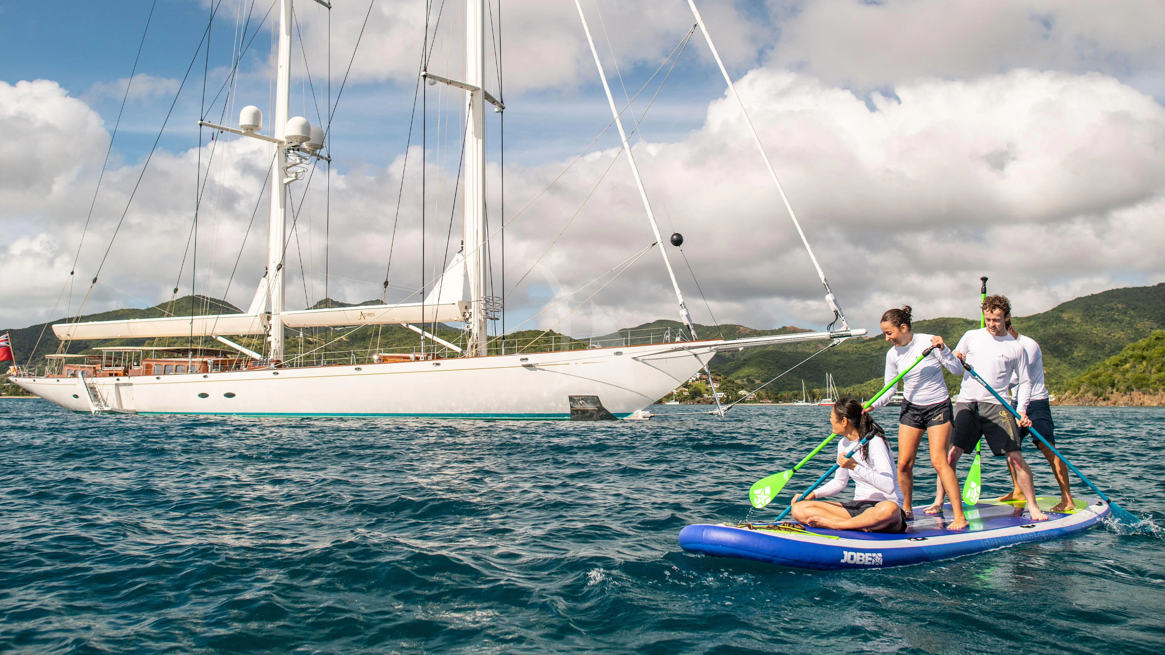 a group of people on a sailboat aboard ATHOS Yacht for Sale