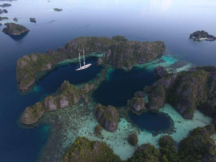 a small island with many islands aboard ATHOS Yacht for Sale